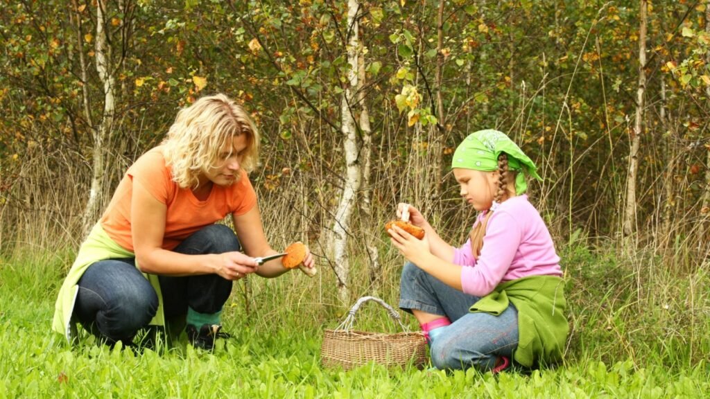 parent and kid searching for wild edibles