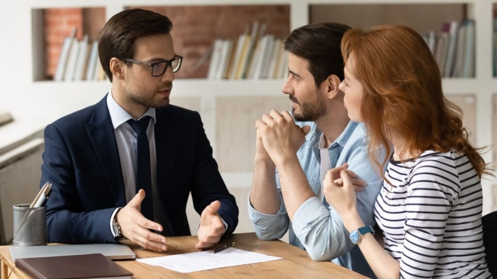 a couple talking to a bank rep