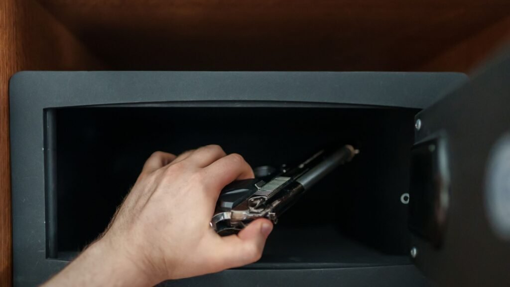 putting gun in a safe
