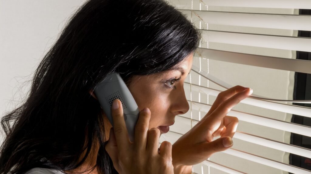 A woman observing through the window