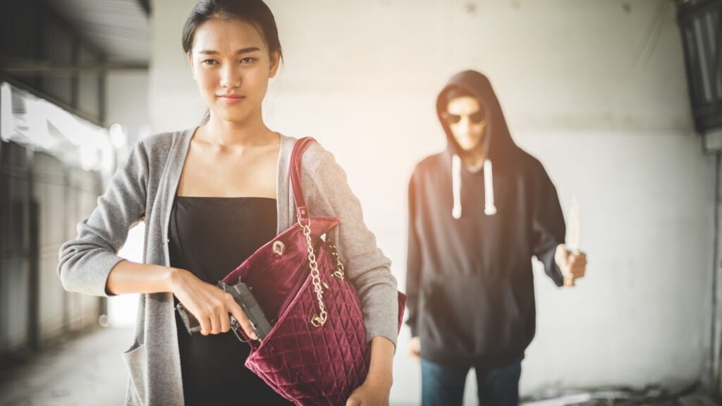 a woman with a gun in her bag
