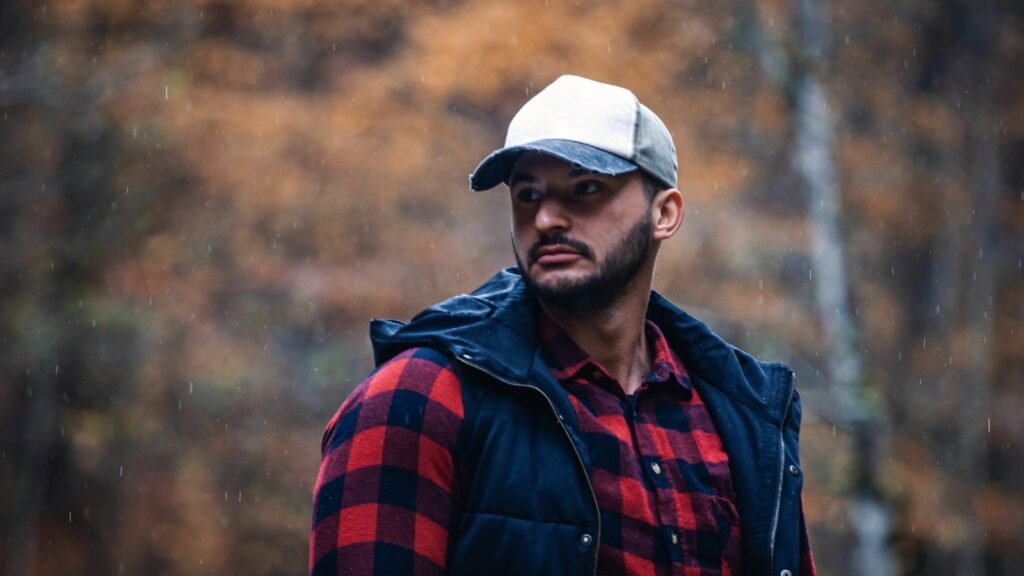 Man listening to the wind in forest