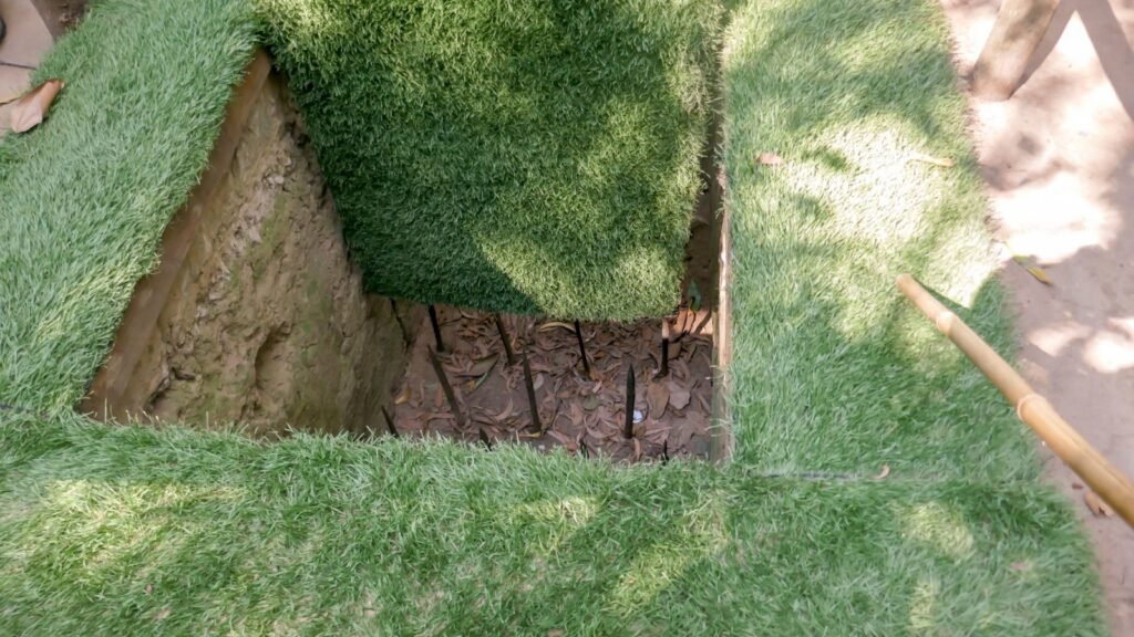 a spike pit trap placed outside the house
