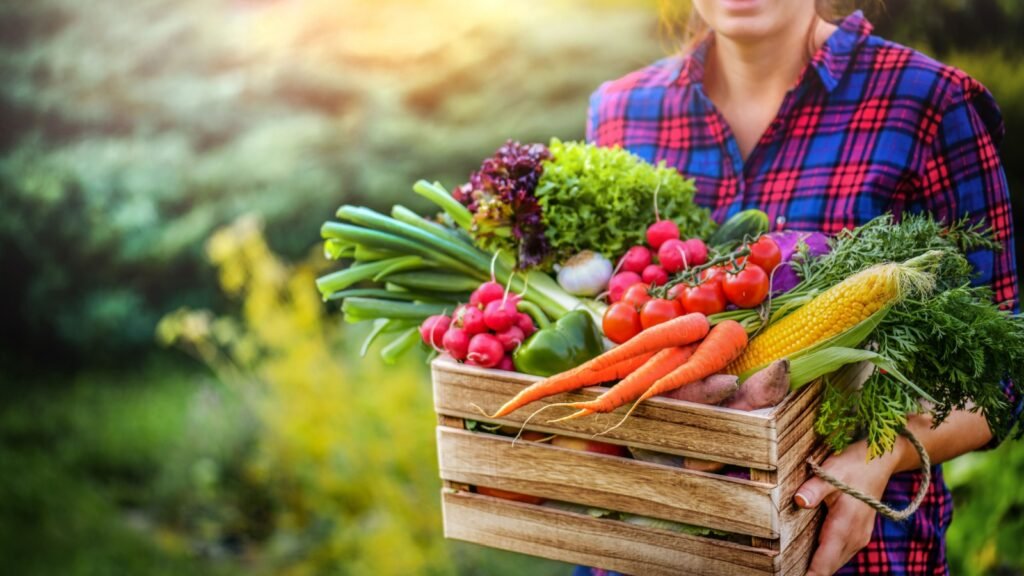 a woman holding a basket of produce
