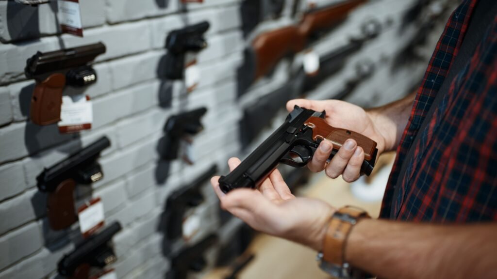 a man buying a handgun
