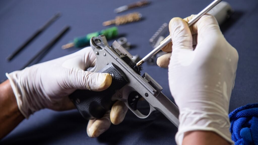 cleaning a disassembled handgun
