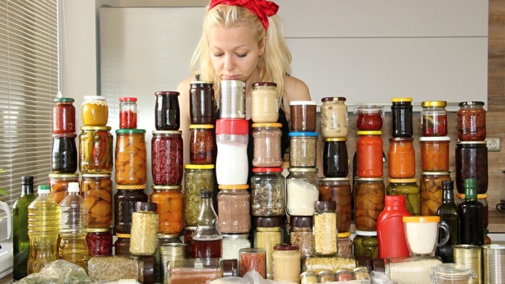 a woman with a lot of canned food
