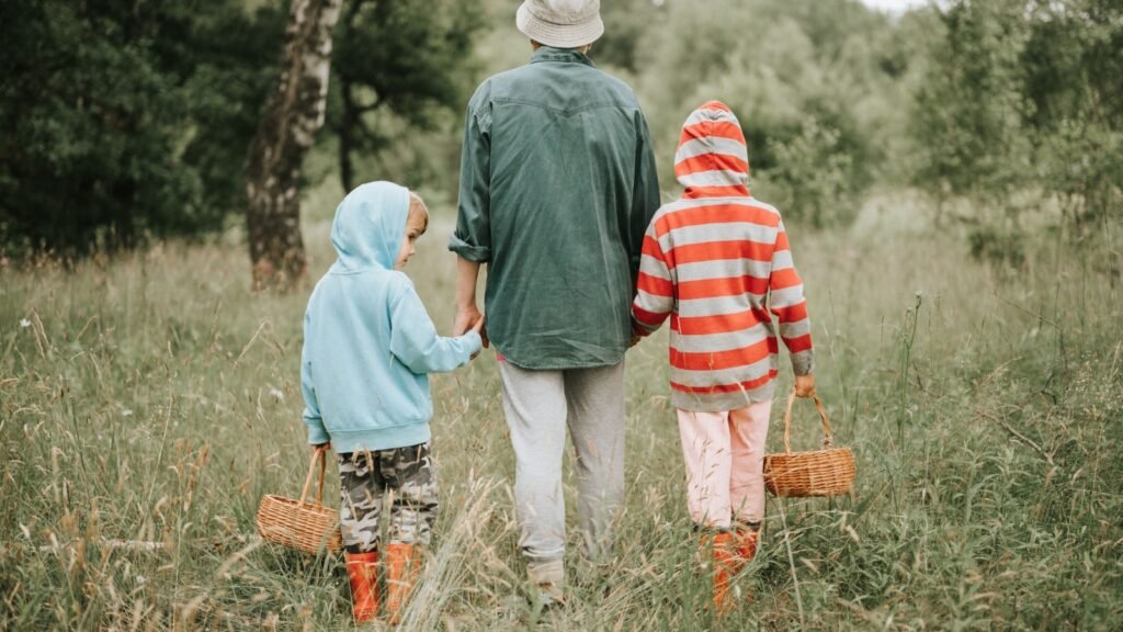 kids with mother foraging mushrooms