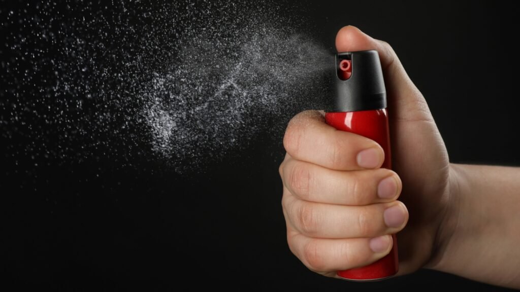 a man using pepper spray
