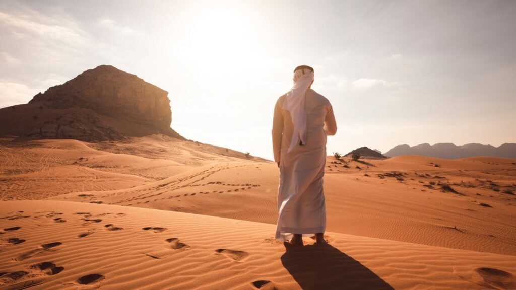 Man navigating sun in desert