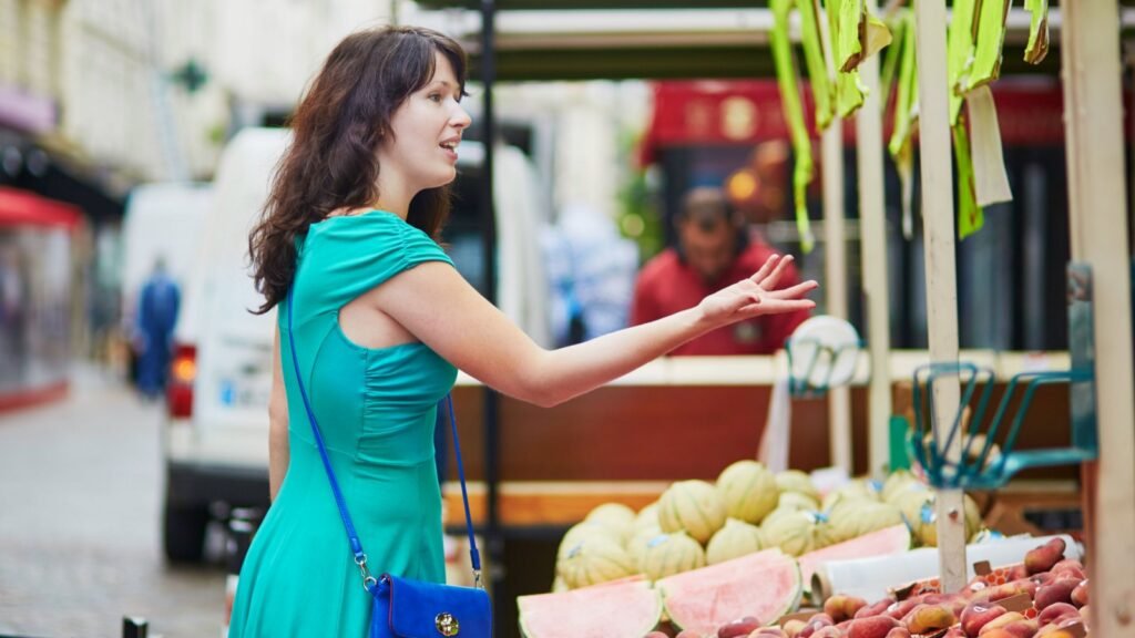 a woman buying fruits
