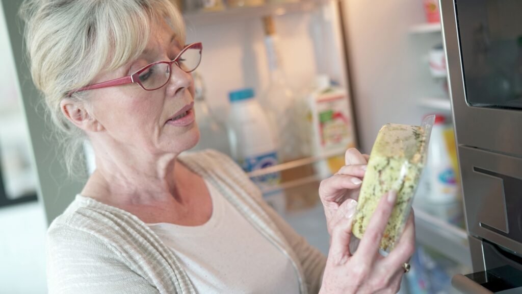 woman checking expiration date
