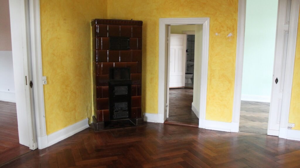 antique masonry heater in an empty house