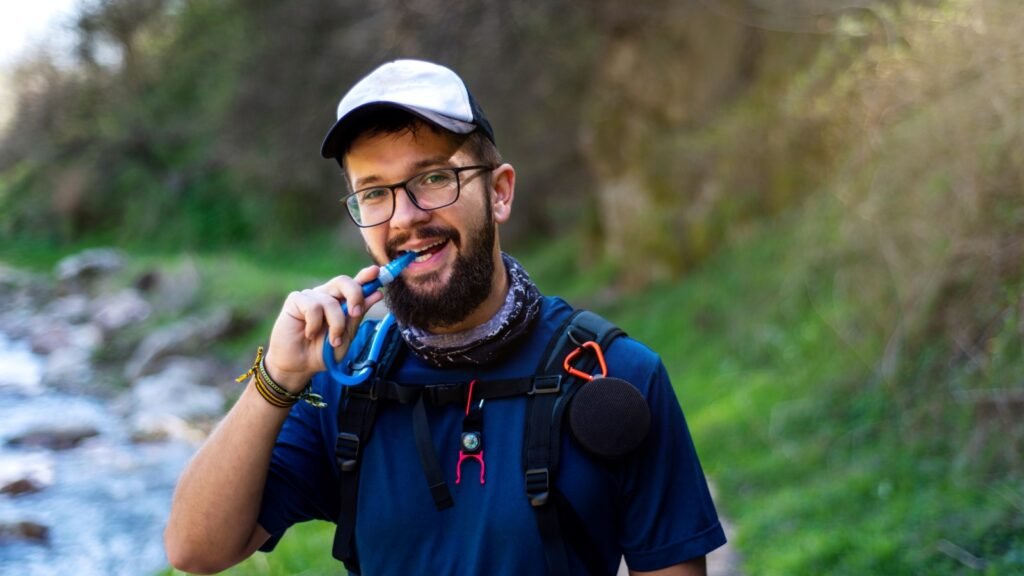 Man hiking in Summer with Hydration Backpack