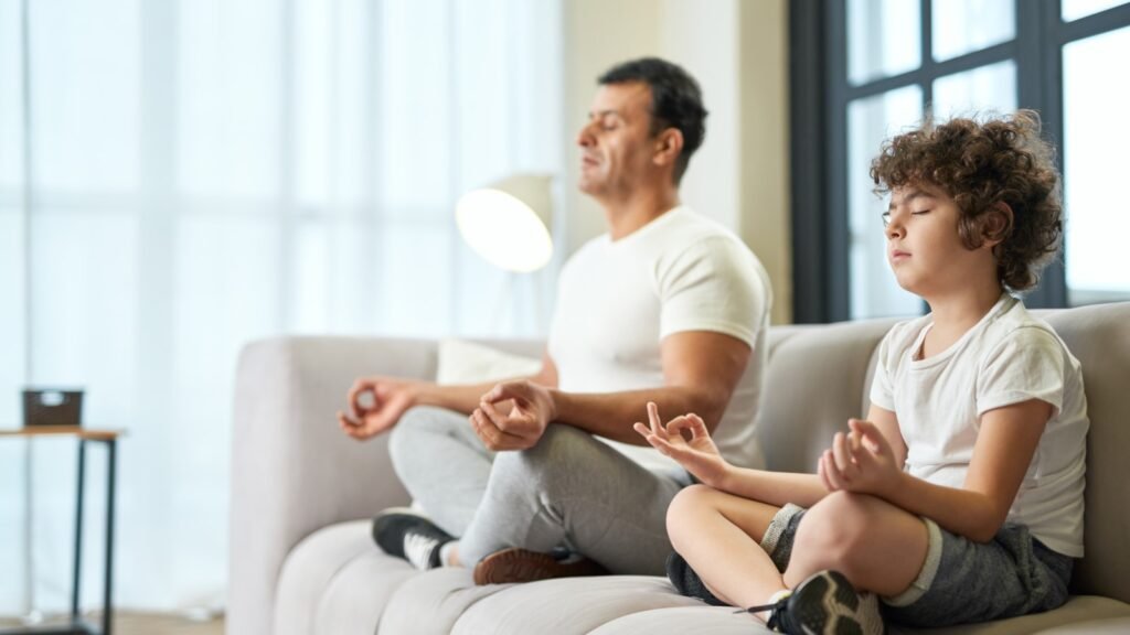 Father and son meditating