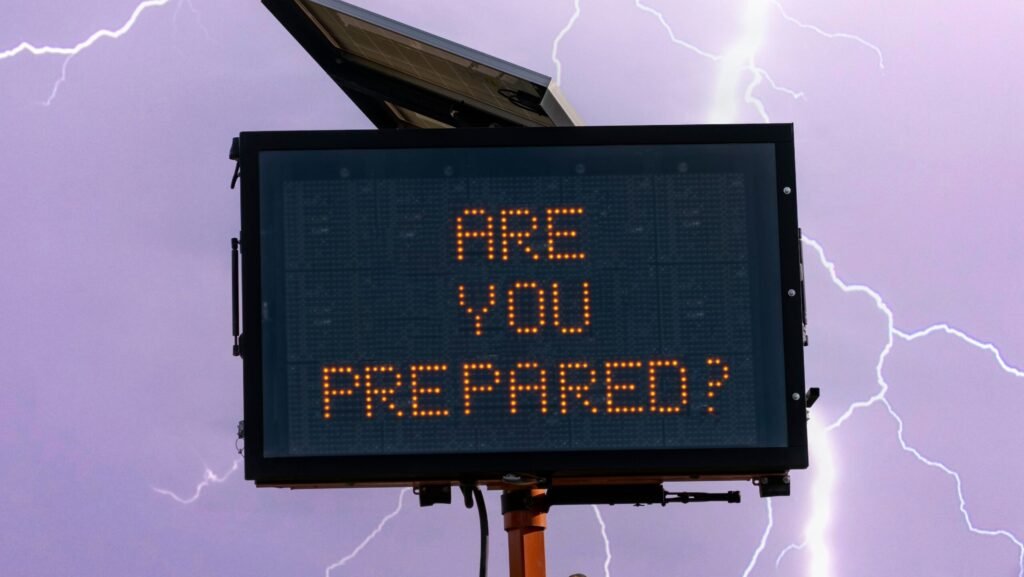 a bright electronic highway message board displaying a public safety alert about emergency preparedness