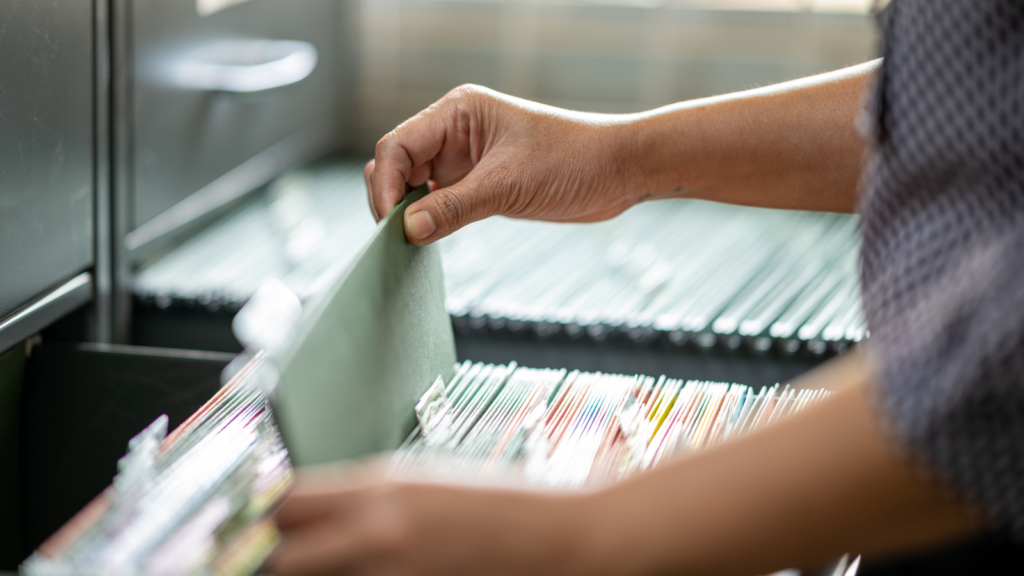 hand arranging documents