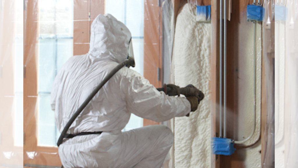 man applying expanding foam