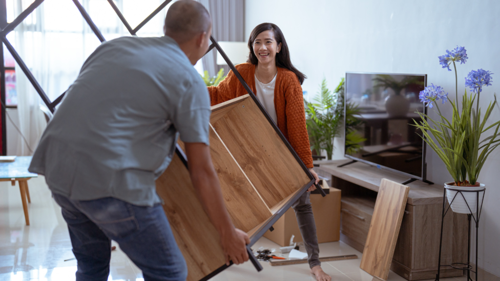 Man and woman moving furniture