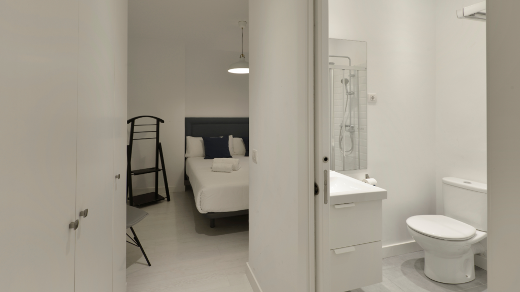 White bedroom with shower