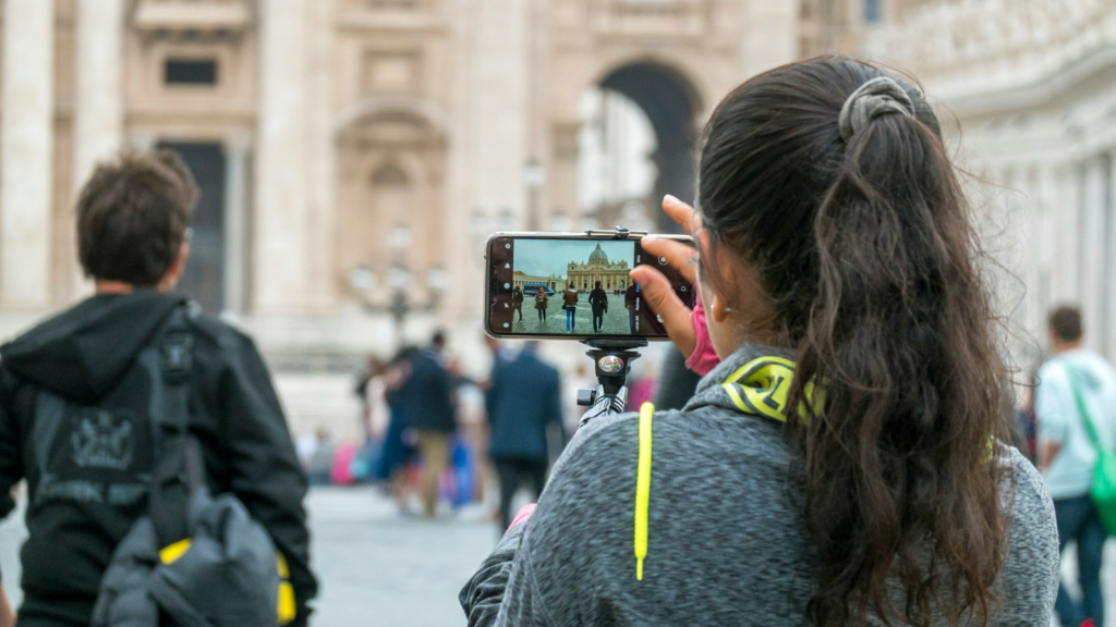 Woman taking photo of strangers